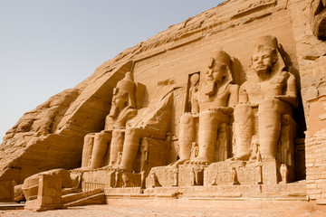 Huge statues of Egyptian King Ramses II seated at the entrance to the Great Temple at Abu Simbel