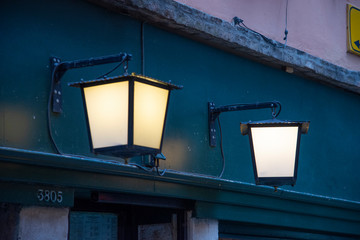 Lanterns outside an illuminated house in Venice, Italy. Night scene.