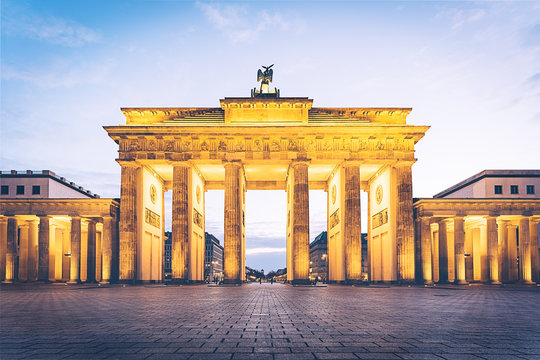 Brandenburg gate illuminated at dawn front view