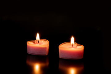 Two pink heart shaped candles love valentines day