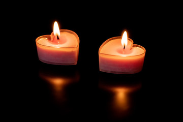 Two pink heart shaped candles love valentines day