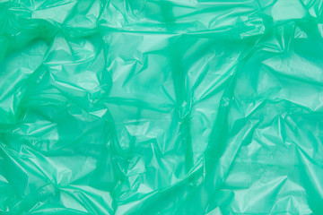 Close up Texture of a Green Plastic garbage Bag. Green Polyethyl
