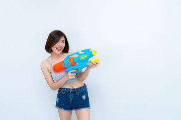 Asian sexy woman with gun water in hand on white background,Festival songkran day at thailand,The best of festival of thai,Land of smile