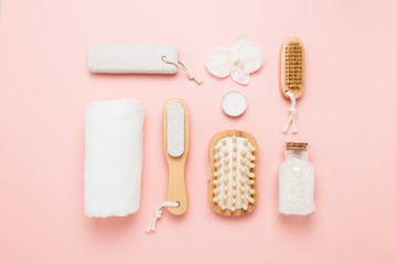 Spa and personal care objects on a very soft pink background
