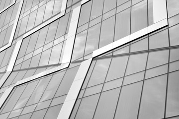 Fototapeta na wymiar Abstract modern architecture with high contrast black and white tone. Architecture of geometry at glass window - monochrome.
