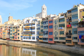 The amazing colorful houses along the river Onyar and the Cathedral of Saint Mary in the gorgeous city of Girona, Catalonia, Spain.