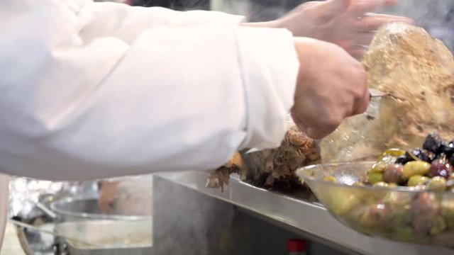 Preparing cow's intestines in Jamma El Fna Market in Marrakesh, Morokko