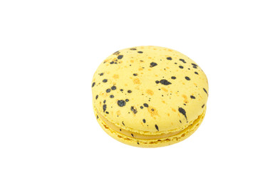 Tasty yellow macaroons with black splashes.