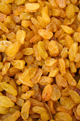 Gold raisins for food texture. Dried fruits background