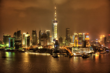 Nocturne view of modern Pudong financial district in Shanghai.