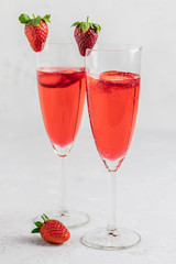 Strawberry party drinks in champagne glasses. Selective focus, copy space.