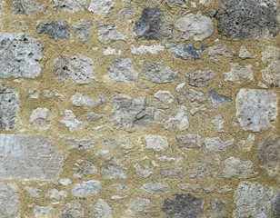 wall of large exposed stones belonging to a medieval castle