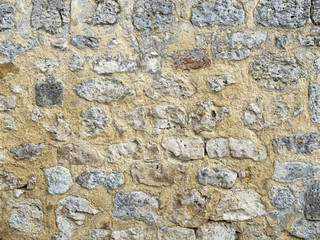 wall of large exposed stones belonging to a medieval castle