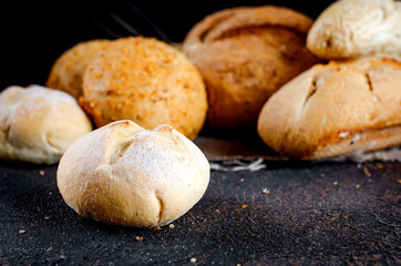 Assortment of baked goods on old dark wooden table