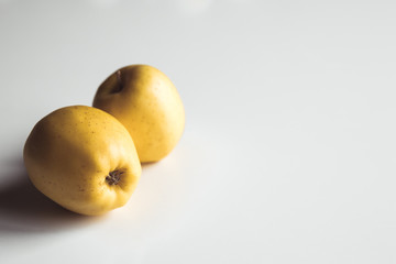 Yellow apples on a white background, wholesome food, farming, vegetarian