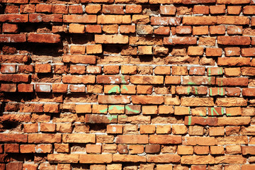 Grunge brick wall background with aging texture closeup