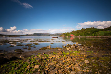 Fishing boat anchors in a beautiful bay near trondheim, norway.