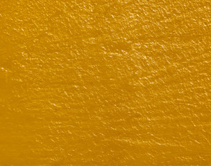 orange golden decorative plaster background, ginger stucco wall with copyspace, abstract wallpaper close up ,yellow texture macro
