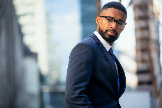 Close up headshot portrait of african american business professional, stylish modern glasses, intelligent and successful