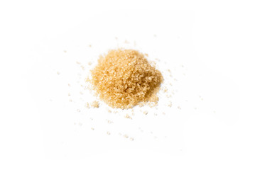 Close-up of a heap of organic raw brown organic sugar isolated on white background
