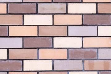 Fototapeta premium multi-colored brickwork for background closeup