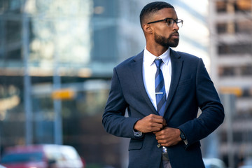 Stylish chic modern style business suit executive, african american male commercial model, walking...