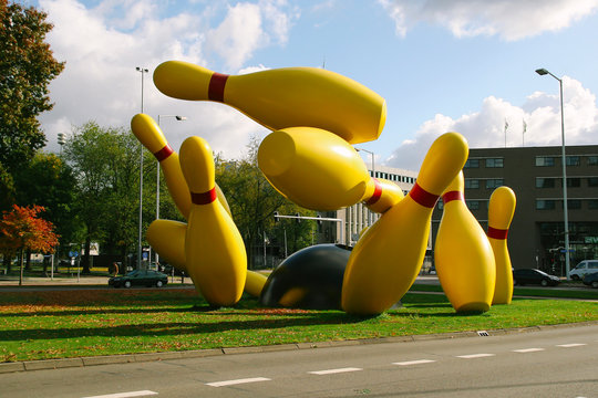 EINDHOVEN, NETHERLANDS - OCTOBER 17, 2009: Bowling strike sculpture in a public park next to the road,  in the city of Eindhoven in Netherlands, on October 2009