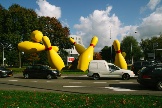 EINDHOVEN, NETHERLANDS - OCTOBER 17, 2009: Bowling strike sculpture in a public park next to the road,  in the city of Eindhoven in Netherlands, on October 2009