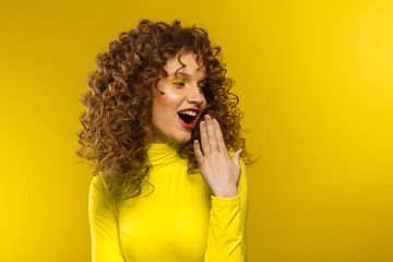 Wow. Reaction on unexpected news. Beautiful women with wide open eyes covering open mouth with...