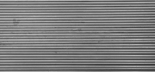 Metal texture pattern, ribbed cast iron surface, textured black background , wall for dark backdrop , loft style interior.