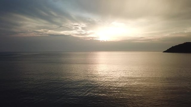 Shot of a beautiful summer sunset at the beach. Sunset at sea drone footage, drone footage  4k  
