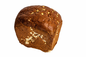 A loaf of rye cereal bread with oatmeal on a white background