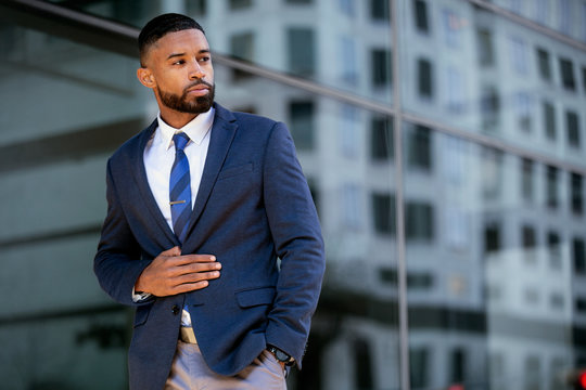 Stylish modern african american businessman, commercial model posing in trendy suit outfit, handsome executive