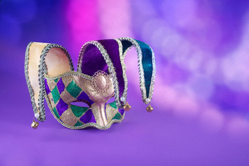 Traditional carnival mardi gras mask on table .Masquerade mask on glitter background. Mardi Gras