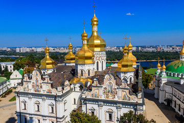 Fototapeta na wymiar View of Dormition Cathedral of the Kyiv Pechersk Lavra (Kiev Monastery of the Caves) and the Dnieper river in Ukraine. View from Great Lavra Bell Tower