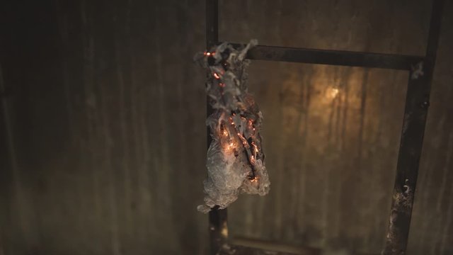 Smoldering materials in a fire test setup. High temperature sample testing. conducting experiments and tests 4k Follow the focus.