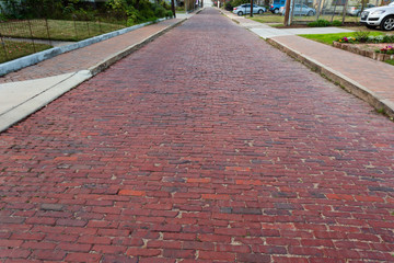 Old brick street near downtown Houston in the Historic Sixth Ward District 
