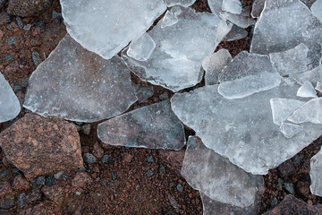Natural background of ice. Large chunks of ice underfoot. Ice on the Bay.