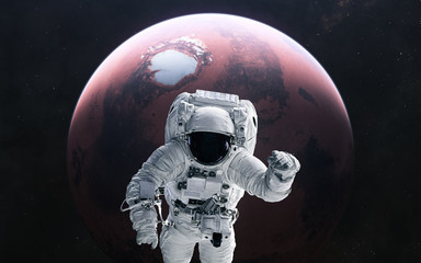 Fototapeta na wymiar Astronaut and Mars. Red planet of the solar system. 3D render. Science fiction. Elements of this image furnished by NASA