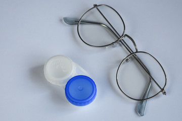  glasses and lenses on a white background