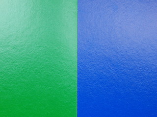 The paper texture is blue and green, and the background has space for text or images.