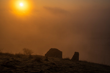 Sunrise time on Radobyl hill over valley of river Labe and Litomerice town
