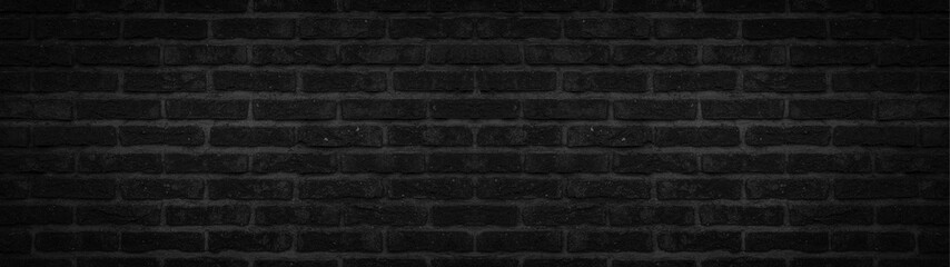 Dark black anthracite rustic brick wall texture banner panorama