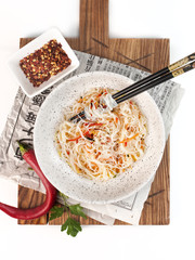 food photography of asian rice glass noodle salad with red chili pepper top view on white background isolated close up
