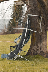 damage trampoline because of hurricane stopped from a tree