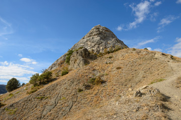 Famous Sugar Head rock in Sudak town, Crimea, Russia.