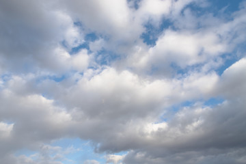Naklejka na ściany i meble White and gray clouds in the sky. Beautiful sky background