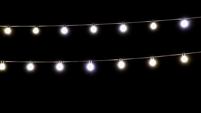 Light garland of light bulbs on a dark background