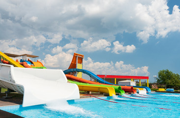 Water park with colorful slides and pools