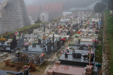 view of a cemitery in a foggy day